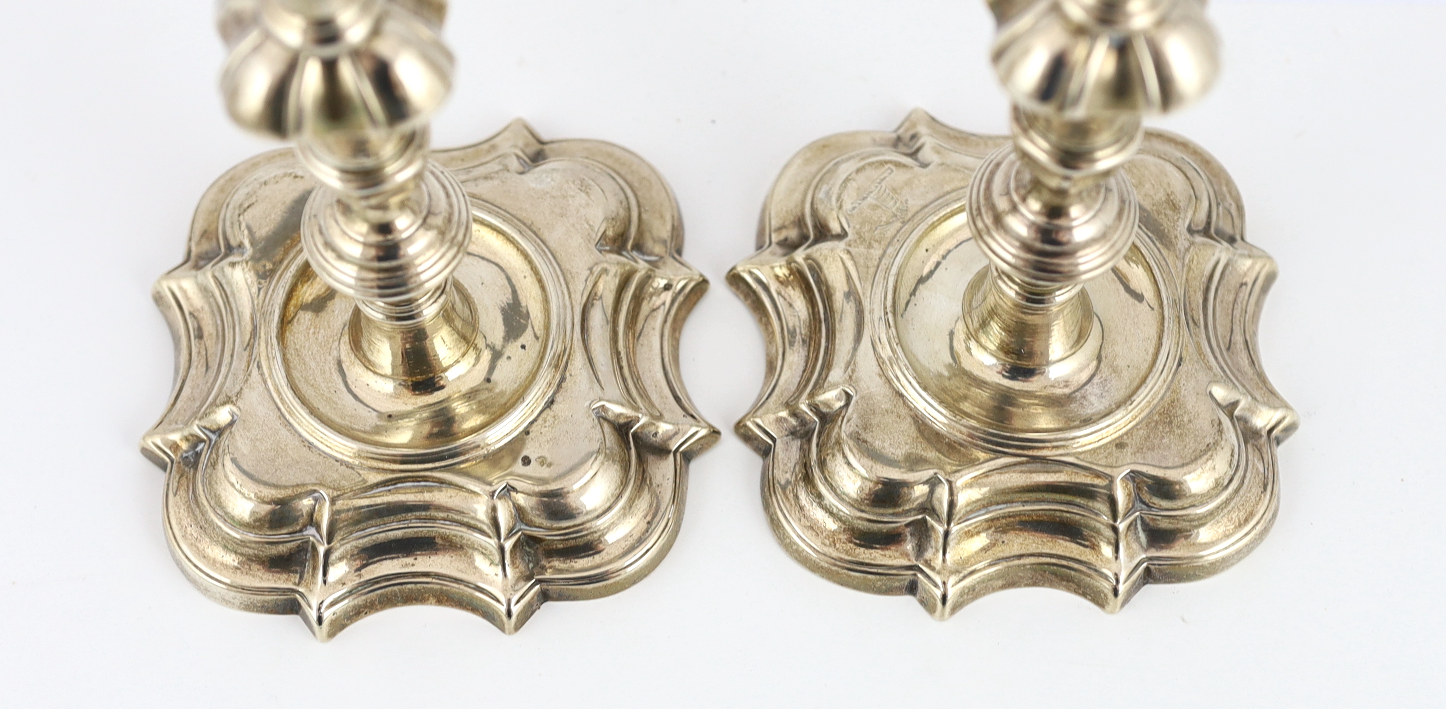 A pair of George II cast silver candlesticks, by Richard Gosling